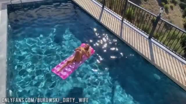 a beautiful blonde masturbates in the pool and lures a peeping guy into a blowjob